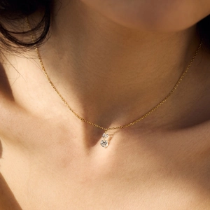 Detailed view of an S925 silver gourd pendant necklace with crystals on a woman's collarbone