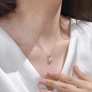 Elegant S925 sterling silver necklace with a round one-carat pendant on a female model