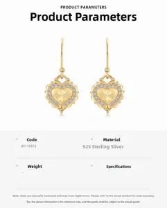Detail of S925 sterling silver heart earrings with brushed gold and zircon accents