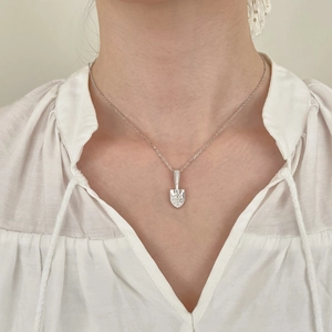 S925 sterling silver necklace with zircon-encrusted shovel pendant on model
