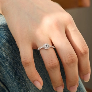 Detailed close-up of a S925 sterling silver halo ring with a round brilliant centerpiece