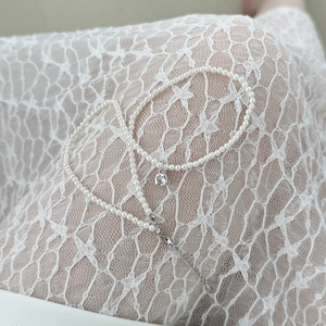 French S925 silver necklace featuring delicate seed pearls and a round zircon pendant