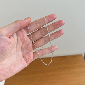 S925 sterling silver minimalist thin cable chain necklace being held by hand