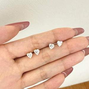 Elegant S925 sterling silver heart stud earrings in gold and silver finish on hand
