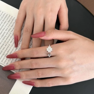 S925 silver four-leaf clover open ring with white cubic zirconia worn by a model