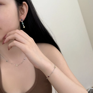 S925 silver jewelry set with colorful heart-shaped zircons worn by a female model