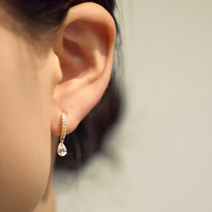 S925 sterling silver gold-plated pear-shaped drop earrings shown on model