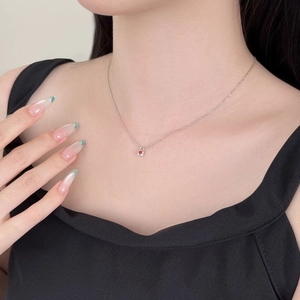 Detailed view of S925 sterling silver padlock necklace with inlaid red heart zircon