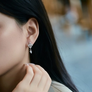 Elegant S925 sterling silver fleur-de-lis earrings with shimmering pavé diamonds