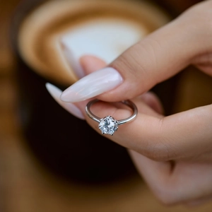 Detailed view of S925 sterling silver ring with sparkling round solitaire diamond setting