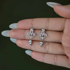 Elegant S925 sterling silver fleur-de-lis drop earrings with sparkling cubic zirconia pavé