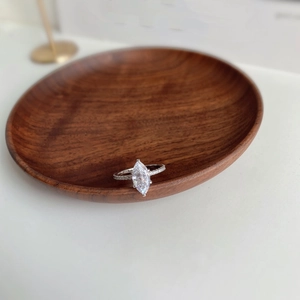 Macro detail of S925 sterling silver ring showing marquise-cut diamond and inner stamp