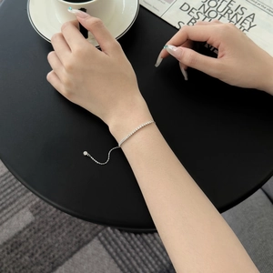 Elegant S925 sterling silver smile bracelet with sparkling zircons worn by a female model