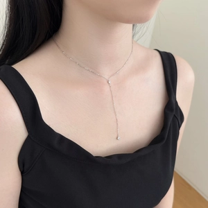 Close-up of elegant S925 silver Y-shaped necklace with delicate CZ diamond pendant on neck