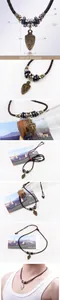 Detailed view of ancient sword alloy pendant with woven leather cord and wooden beads