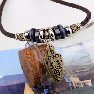 Ethnic braided leather necklace with vintage bronze arrow pendant and wooden beads accent