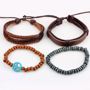 Stackable four-piece leather bracelet set with wooden beads and blue peace sign charm