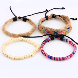 Handmade Nepalese bohemian woven bracelet set with colorful wax ropes and wooden beads