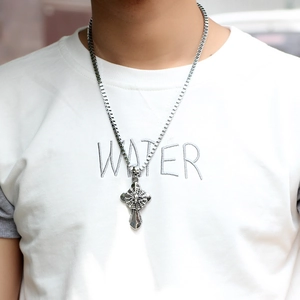 Gothic punk silver spider cross pendant necklace for men worn on a white t-shirt