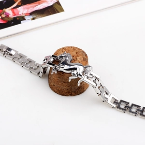 Sleek silver metal link bracelet featuring a detailed galloping horse relief on a cork base