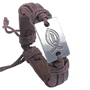 Dettaglio del bracciale vintage in pelle con placca in metallo, Gesù e simbolo pesce