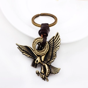Classic antique bronze eagle keychain with spreading wings and dark brown leather cord