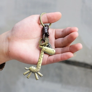 Retro bronze giraffe keychain with leather weave cord and vintage metal finish