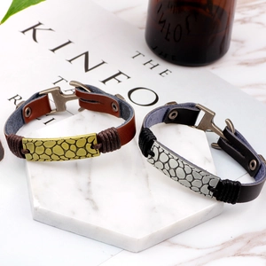 Vintage leather bracelets with hammered metal plates in black and brown finishes