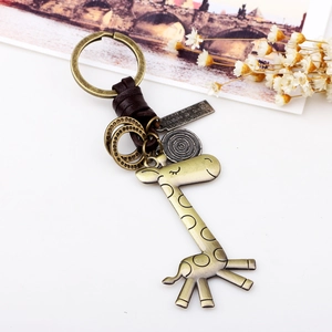 Vintage bronze giraffe keychain with brown leather accents and engraved metal plate
