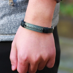 Men's black leather bracelet with Greek meander pattern metal plate on wrist