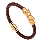 Detail view of the woven brown leather bracelet featuring golden skulls and magnetic clasp