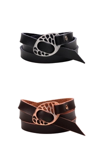 Detail of multi-layer leather bracelets with hollow metal buckles in black and brown