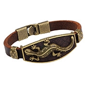Detail of vintage leather bracelet with bronze gecko plaque and clasp closure