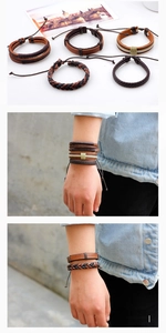 Detail von mehrlagigen braunen Lederarmbändern mit verstellbarem Kordelzugverschluss