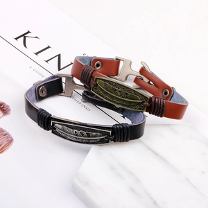 Vintage braided genuine leather bracelet with antique metal feather charm and snap button