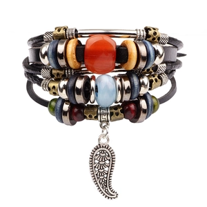 Multilayer bohemian black leather bracelet with leaf pendant and colorful beads on white back