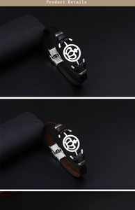 Detail of woven leather bracelets with stainless steel crown and anchor charms