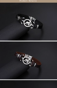 Detail of woven leather bracelets in black and brown with stainless steel alphabet charms