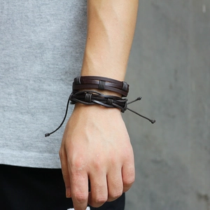 Men's 5-piece multilayer braided leather bracelet set with punk rivets on male wrist