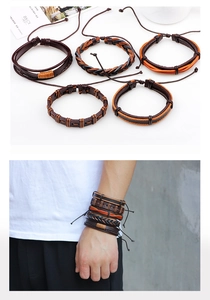 Macro view of brown braided leather bracelets set with adjustable drawstring closure