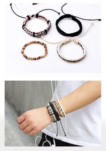Detail of four-piece handmade leather bracelets featuring wooden beads and woven cords