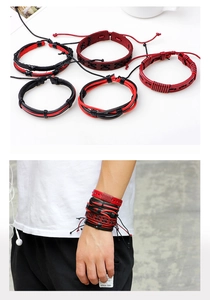 Detail of five-piece set of men's braided leather bracelets in black and red punk style
