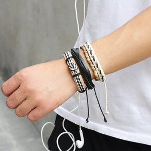 Men's bohemian layered bracelet set with leather cords and wooden beads on wrist