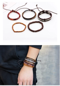 Detailed view of 5-piece leather and wood bead adjustable braided bracelet set on wrist