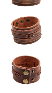 Vue détaillée du large bracelet en cuir marron rétro avec boutons pressions et surpiqûres