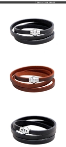 Detail of multi-layer braided leather bracelets with silver magnetic clasps on white background