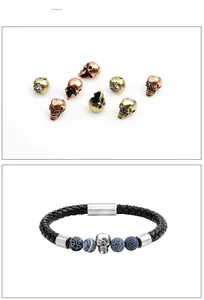 Detail view of skull beads and black braided leather bracelet with magnetic clasp