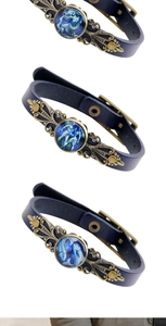 Gros plan de bracelets de zodiaque en cuir rétro avec finition bronze et breloques en verre