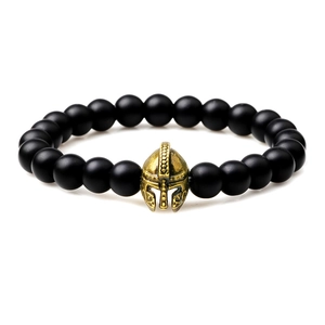Spartan helmet beaded bracelet with matte black onyx stones and golden gladiator charm
