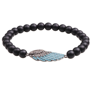 Black matte beaded bracelet featuring a copper-plated zircon inlaid wing charm